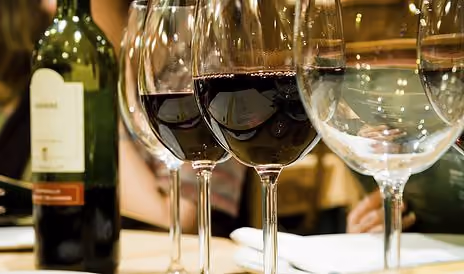 Glasses of red wine on a table
