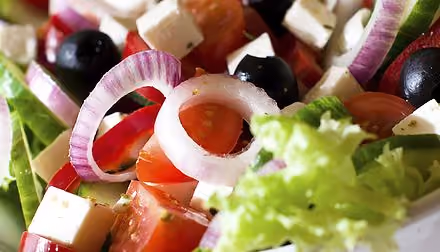 Bulgarian salad with tomato, onion, olives and white cheese